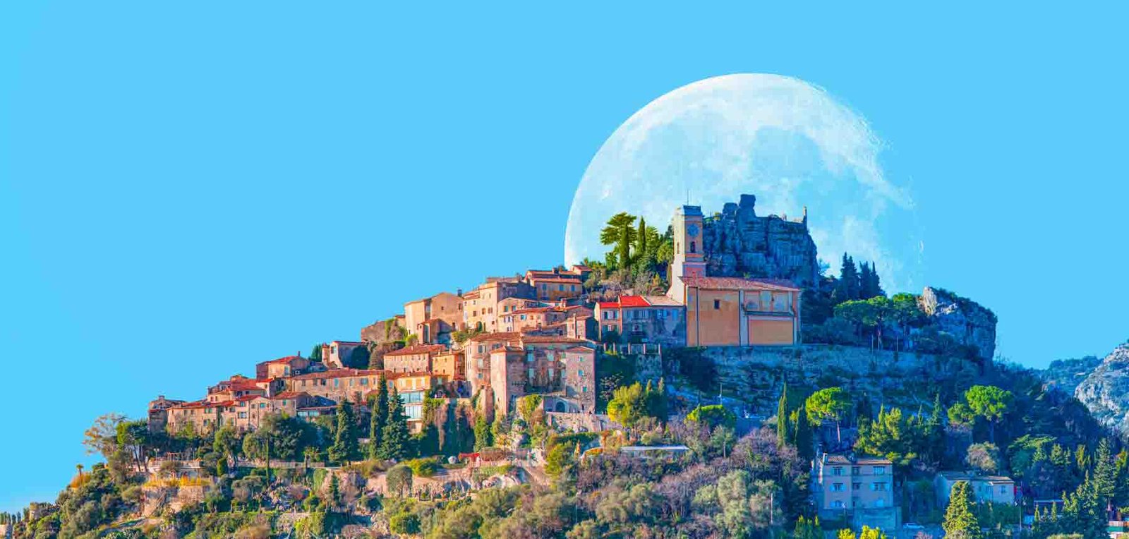 Eze village is a famous tourist destination on French Riviera with full moon - Nice, France "Elements of this image furnished by NASA"