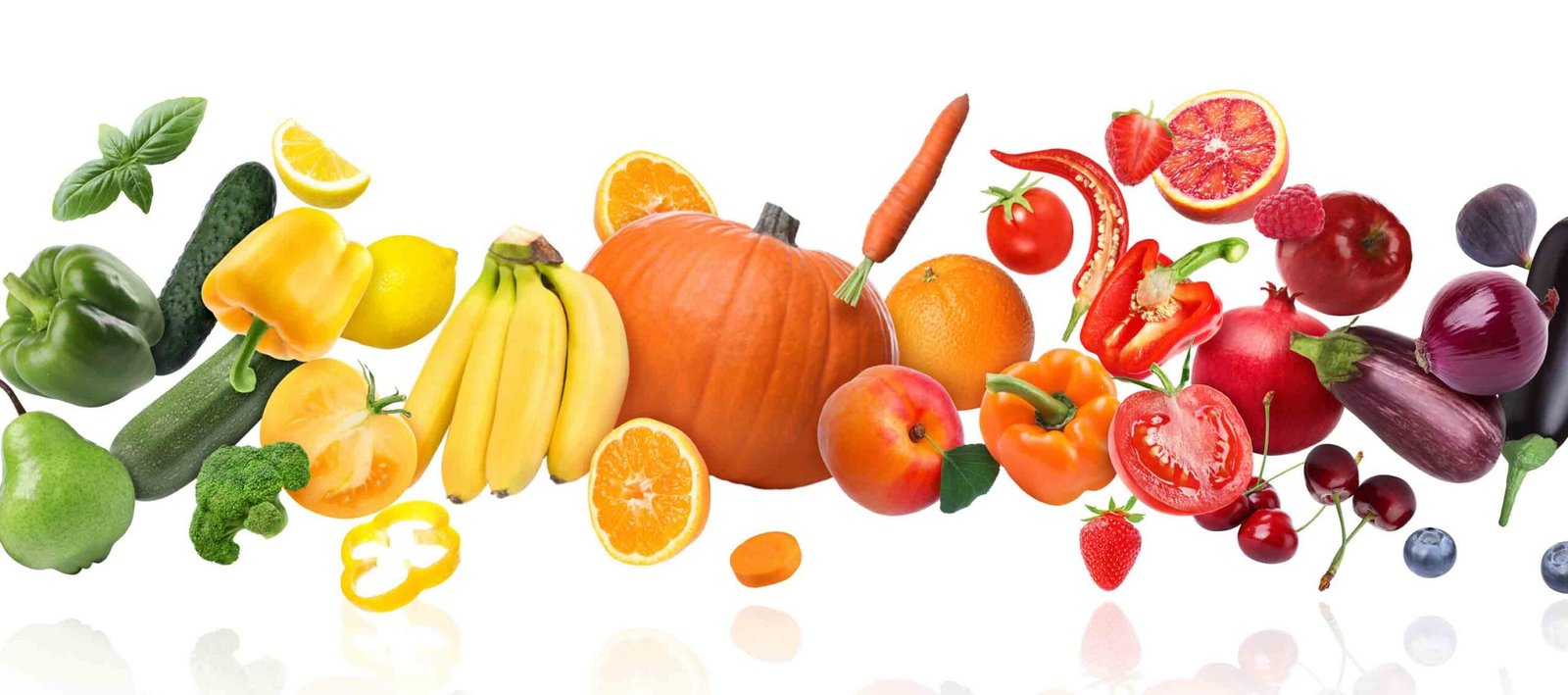 Different fresh fruits and vegetables in air on white background